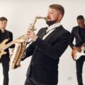 A lively jazz band playing different instruments on stage, creating a vibrant musical atmosphere.