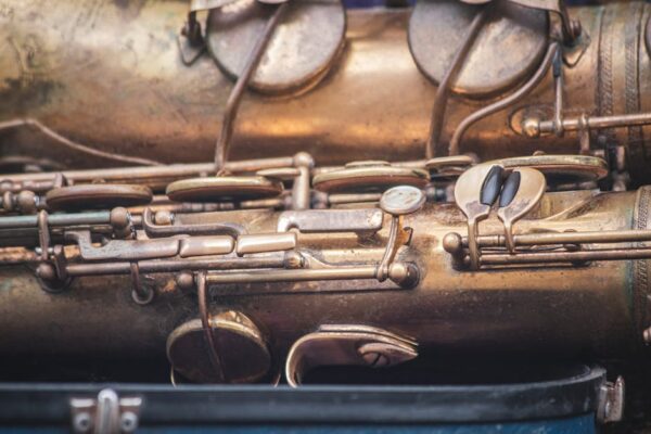 Detailed close-up of a vintage saxophone showcasing brass components and intricate design.