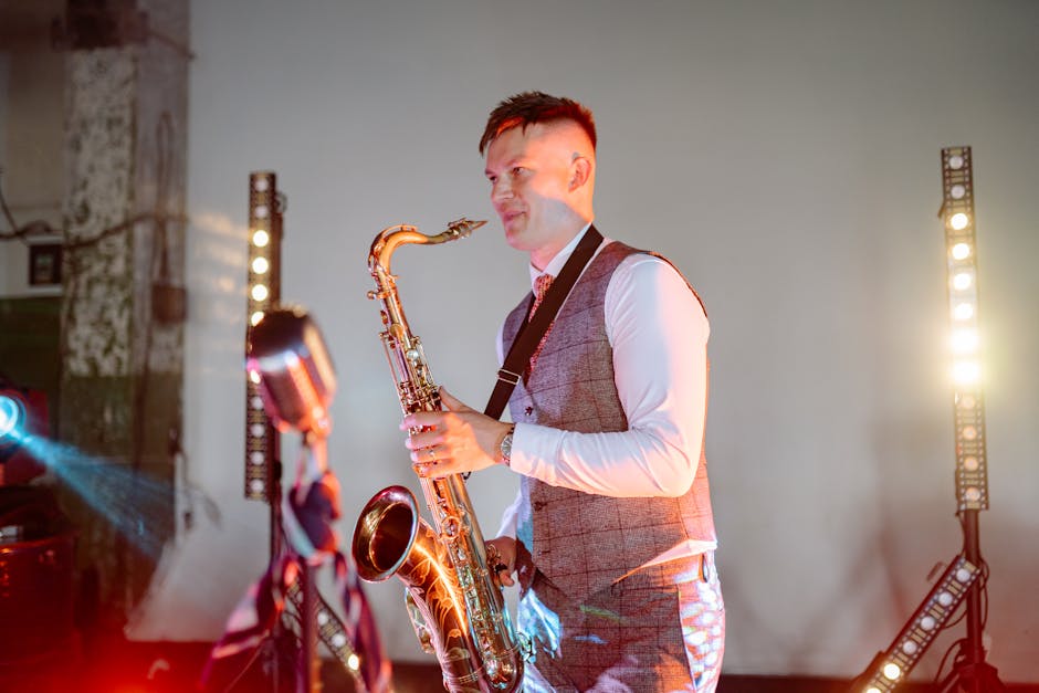 A talented musician plays saxophone with stage lighting at an indoor event. Vibrant and dynamic.