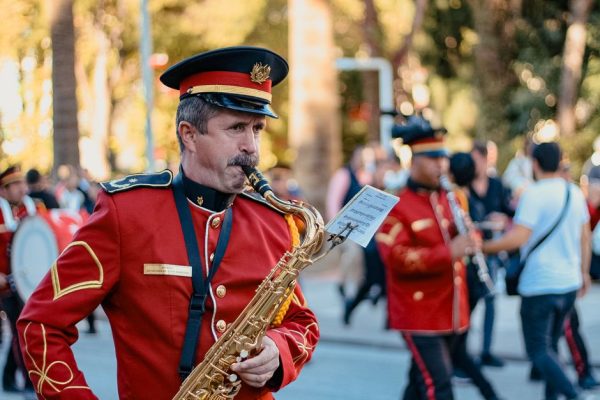 Vibrant marching band performance in Denizli, Turkey captured outdoors with musicians in uniform.