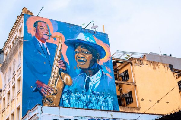 Colorful mural depicting jazz musicians on a building façade in Rio de Janeiro, Brazil.