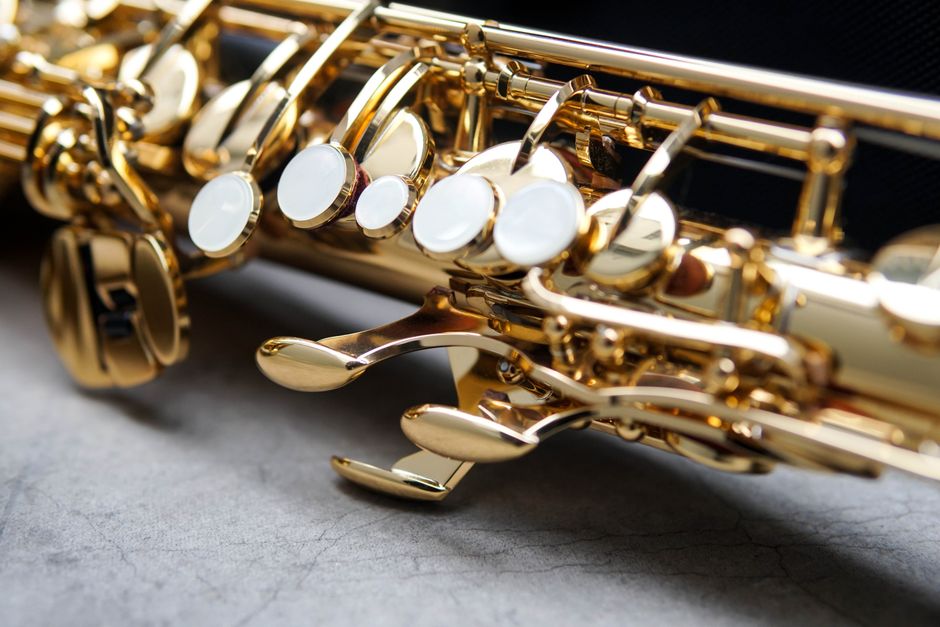 Detailed close-up of saxophone keys showcasing intricate brass craftsmanship.