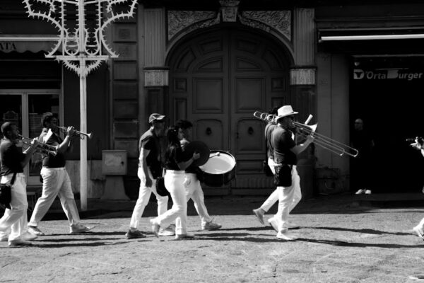 A lively street band marching in Giugliano, showcasing Italian culture and music.