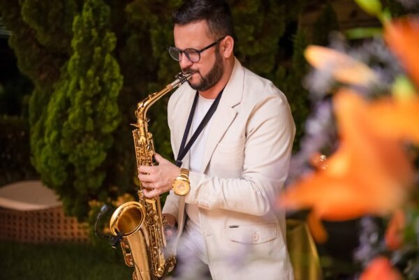 A saxophonist playing outdoors in Salvador, Brazil, creating a lively musical atmosphere.